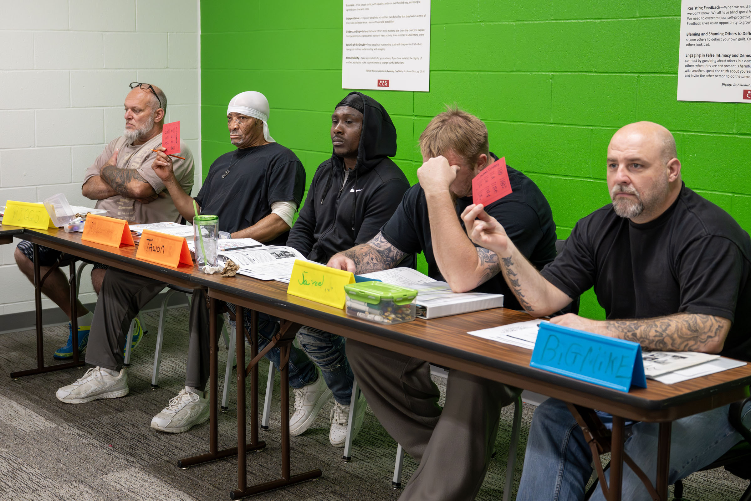 “Big Mike” Fritchey, TCKC program participant, holds up a card with an array of needs during a TCKC conflict resolution activity. Students in the class learn how to improve communication, deescalate tense situations and make better interpersonal choices.