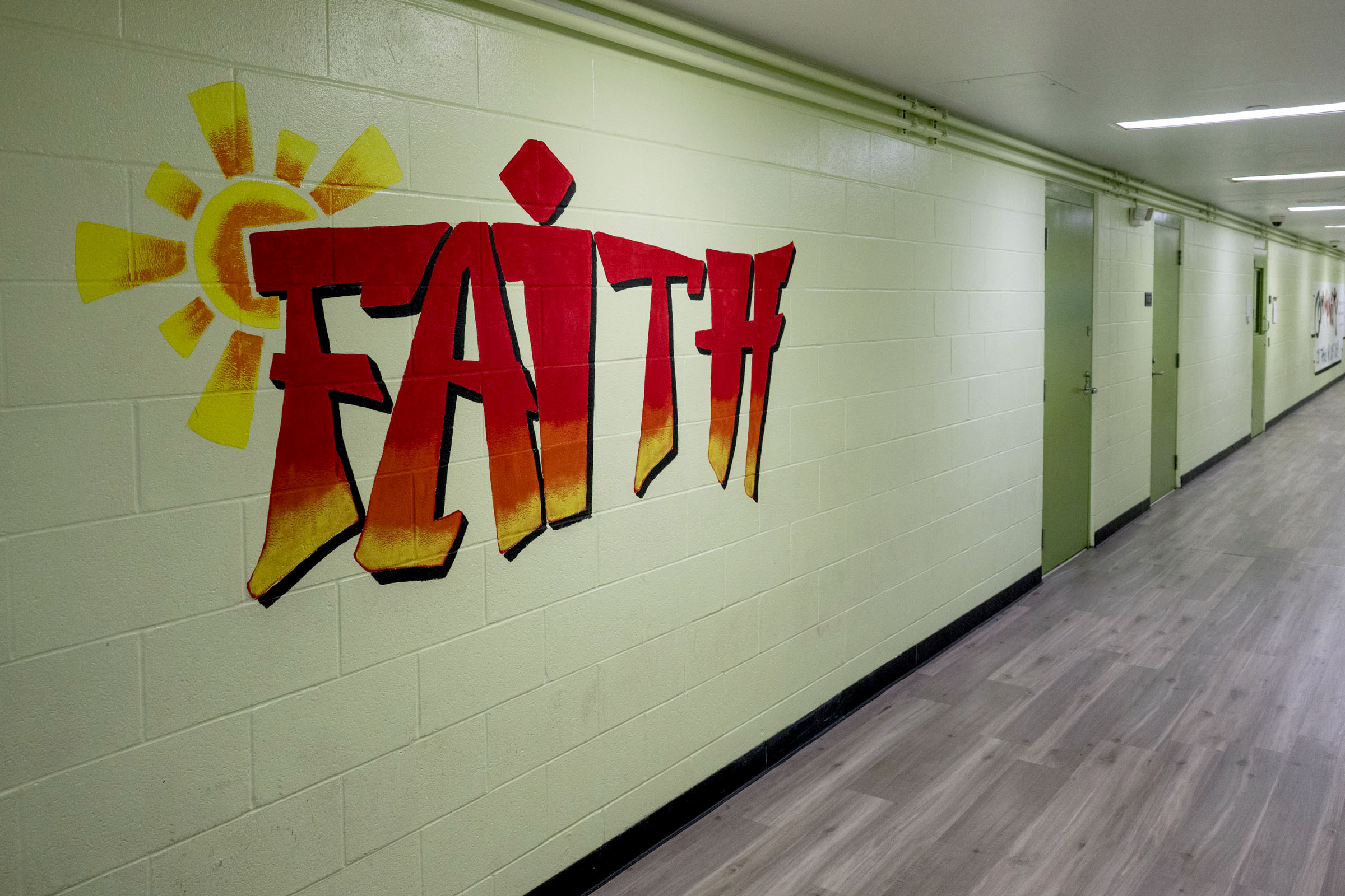 Residents contribute to the décor inside the TCKC. Murals feature motivational street-art messages, logos of Kansas City sports teams and other elaborate designs.