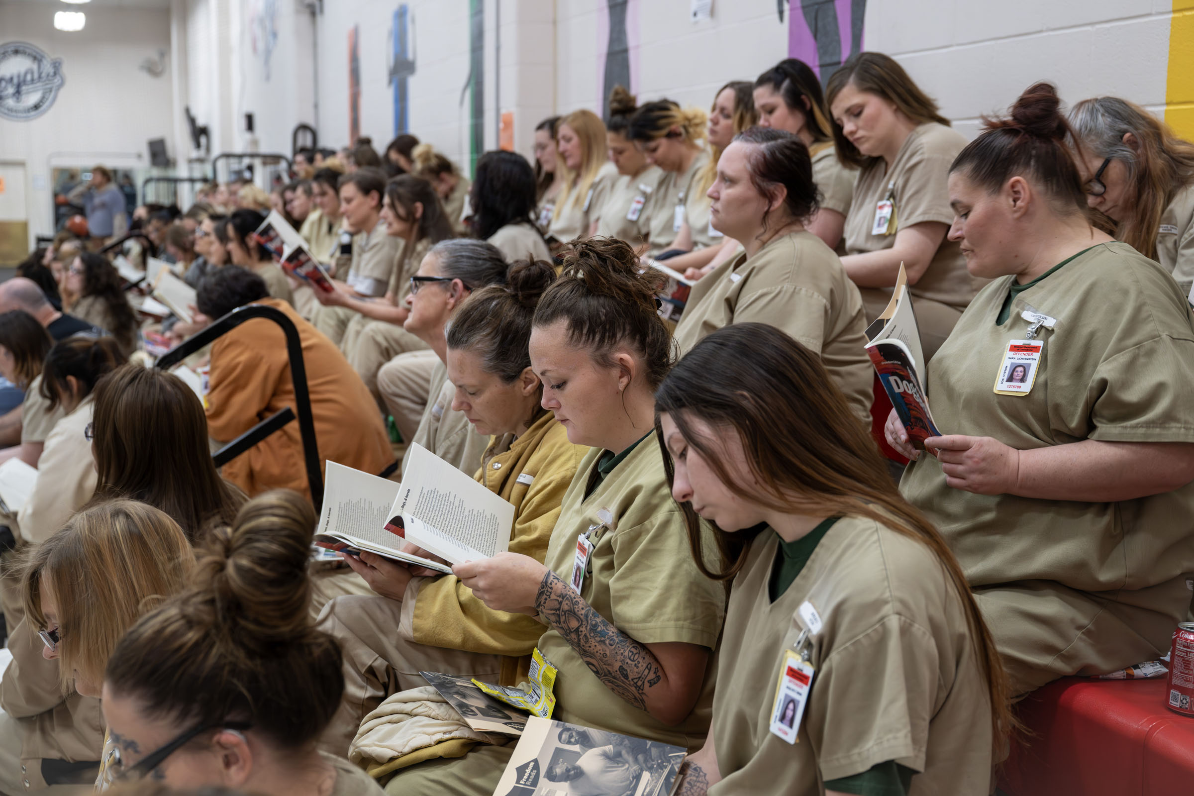 Residents intently follow along during a poetry reading by poet Reginald Dwayne Betts. All attendees received copies of Betts's book titled Doggerel.