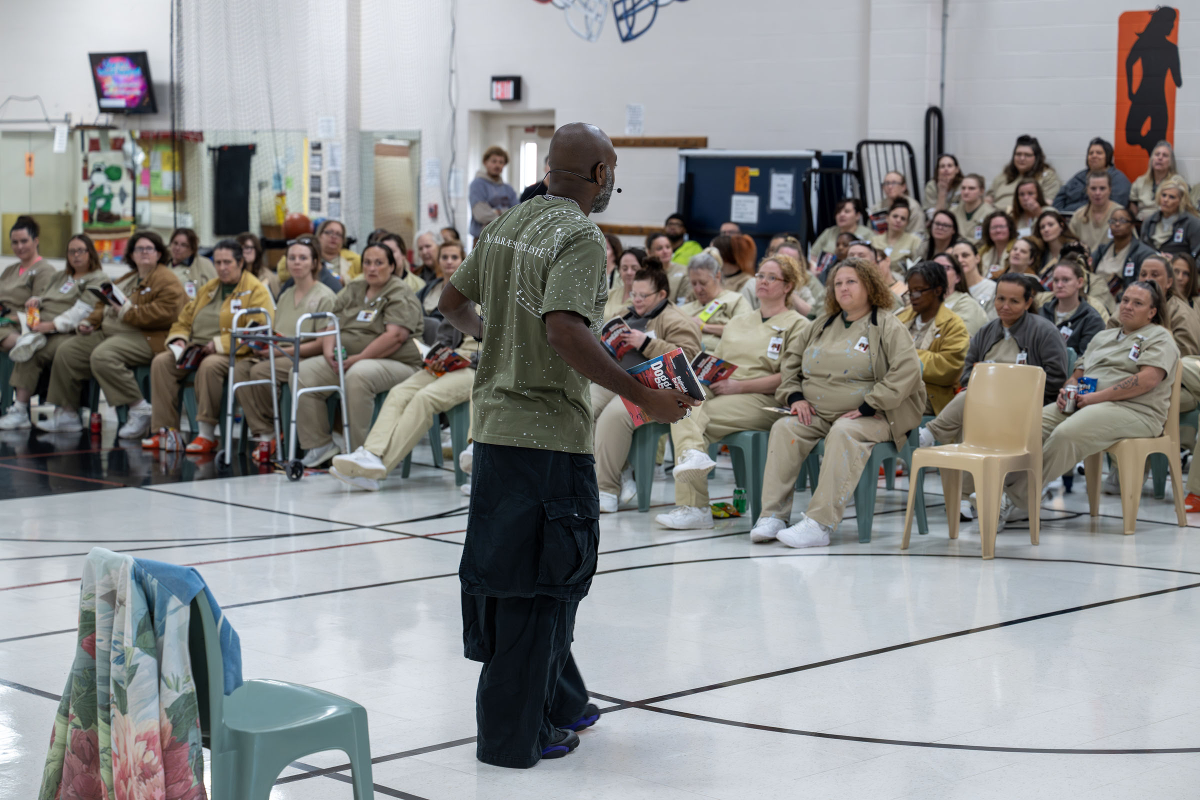 Poet Reginald Dwayne Betts addresses women's prison residents during a reading and book talk.