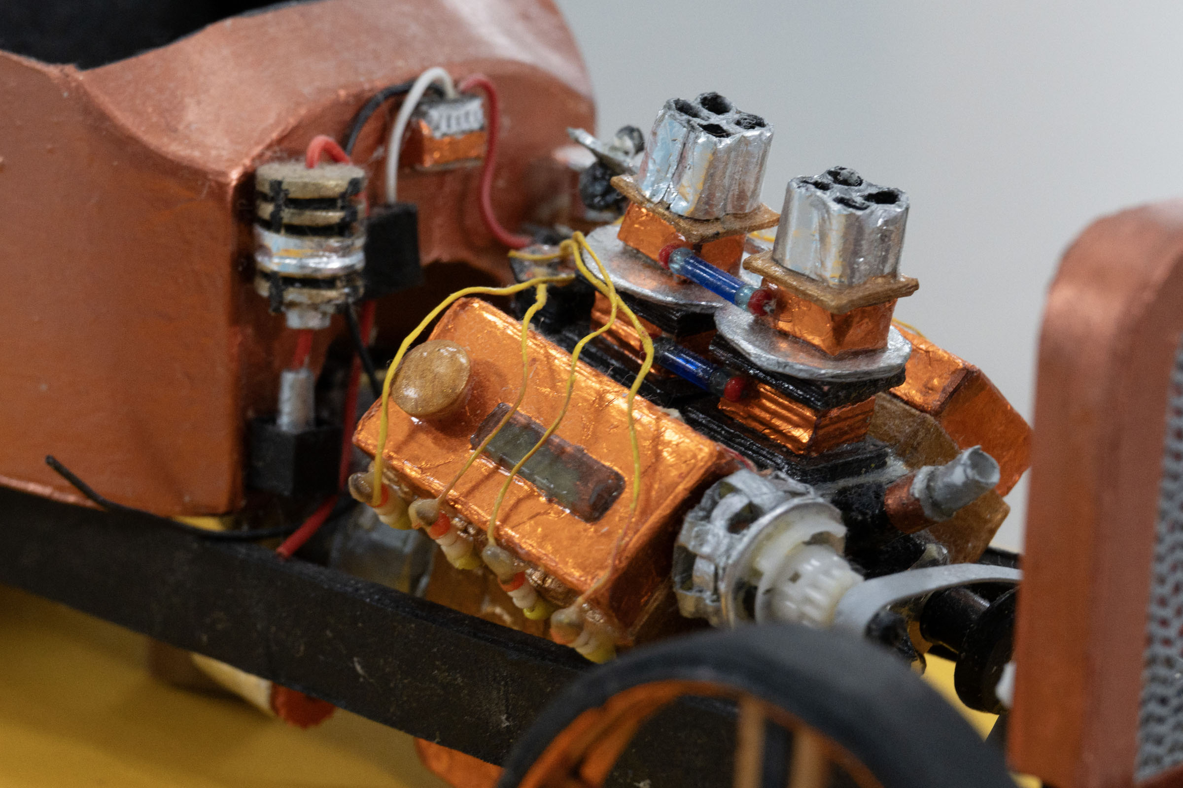Detail photo of a hot-rod engine with hand-painted parts