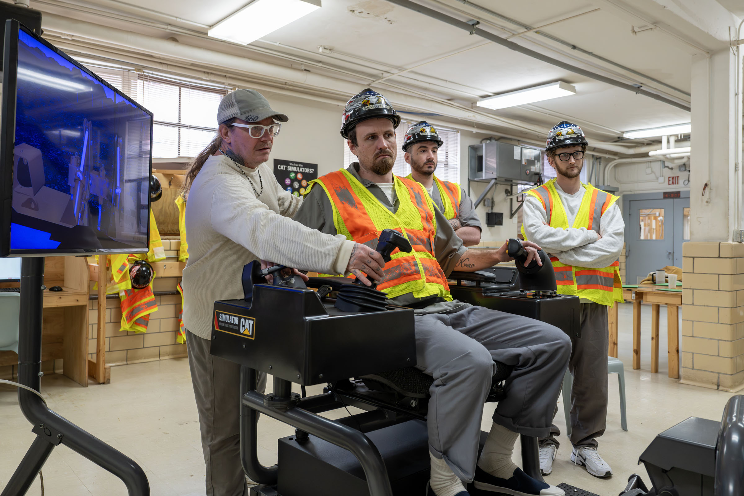 Students learn to operate heavy equipment on simulator