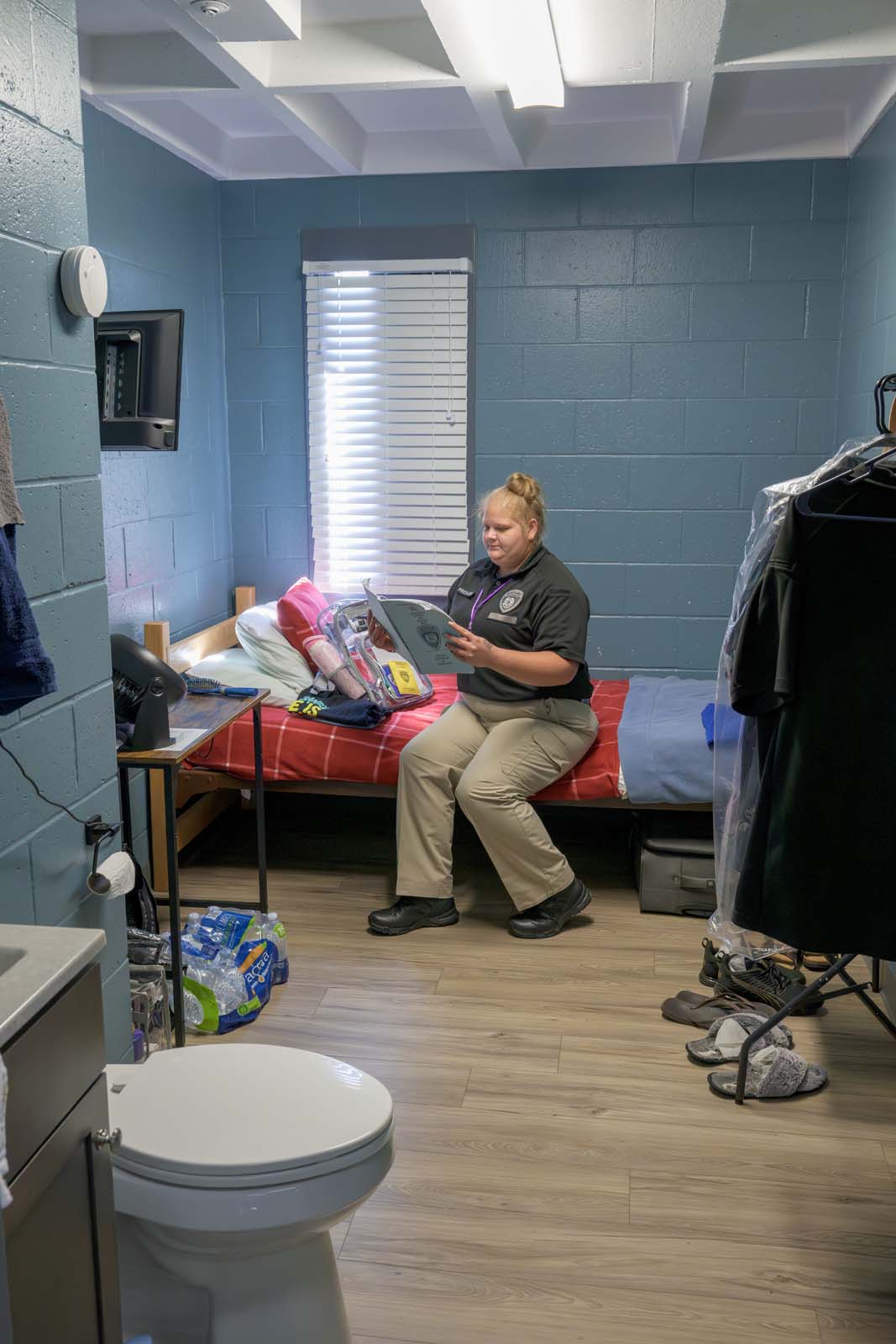 A student sits on her bunk in an AEC dormitory.