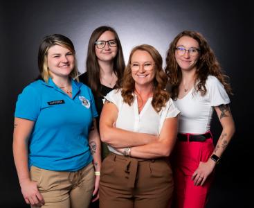 Mother and daughters working together at DOC