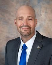 Acting Director Trevor Foley