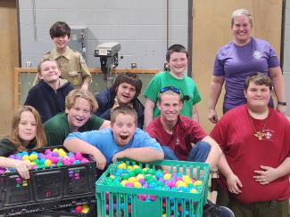 Troop 549 volunteers fill Easter eggs