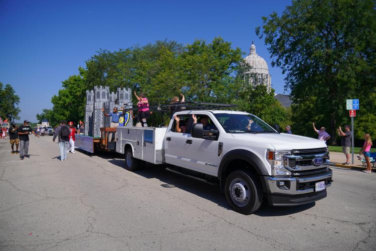 Truck pulling a parade float