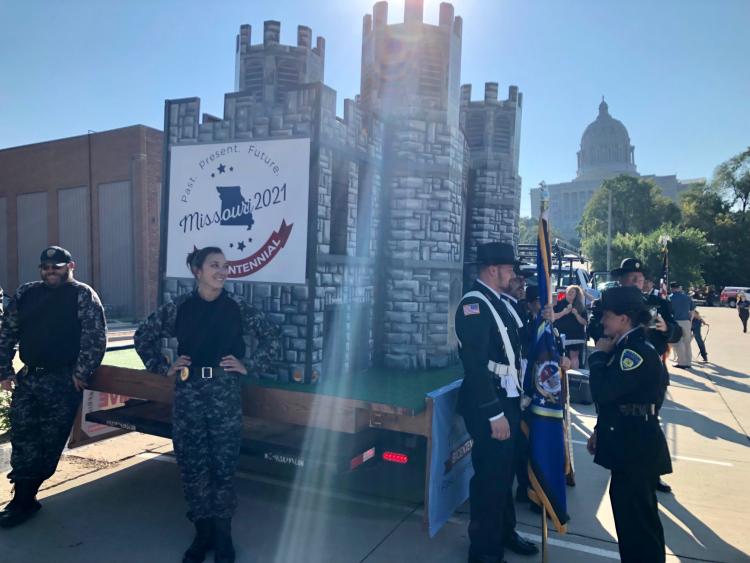 Staff standing around parade float