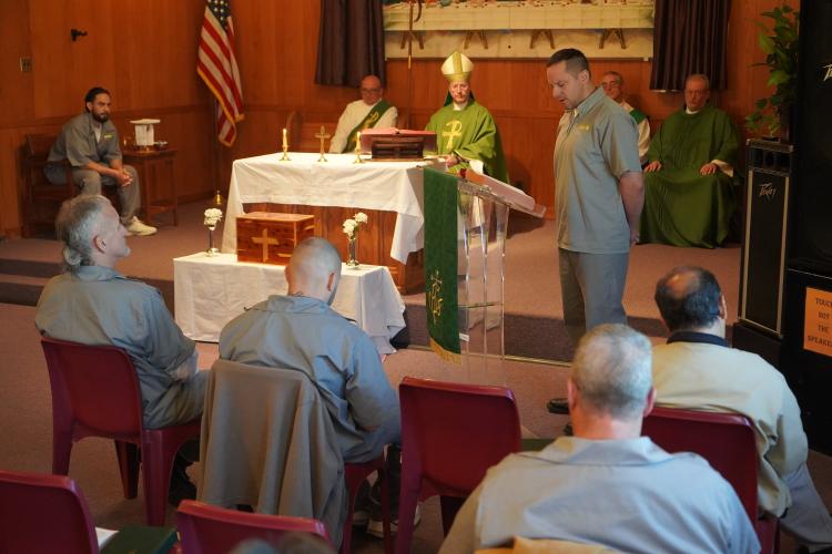 Bishop W. Shawn McKnight with offenders conducting mass at Algoa Correctional Center