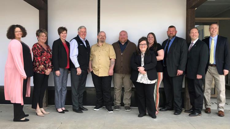 Governor Parson with corrections staff, treatment providers and George Lanier