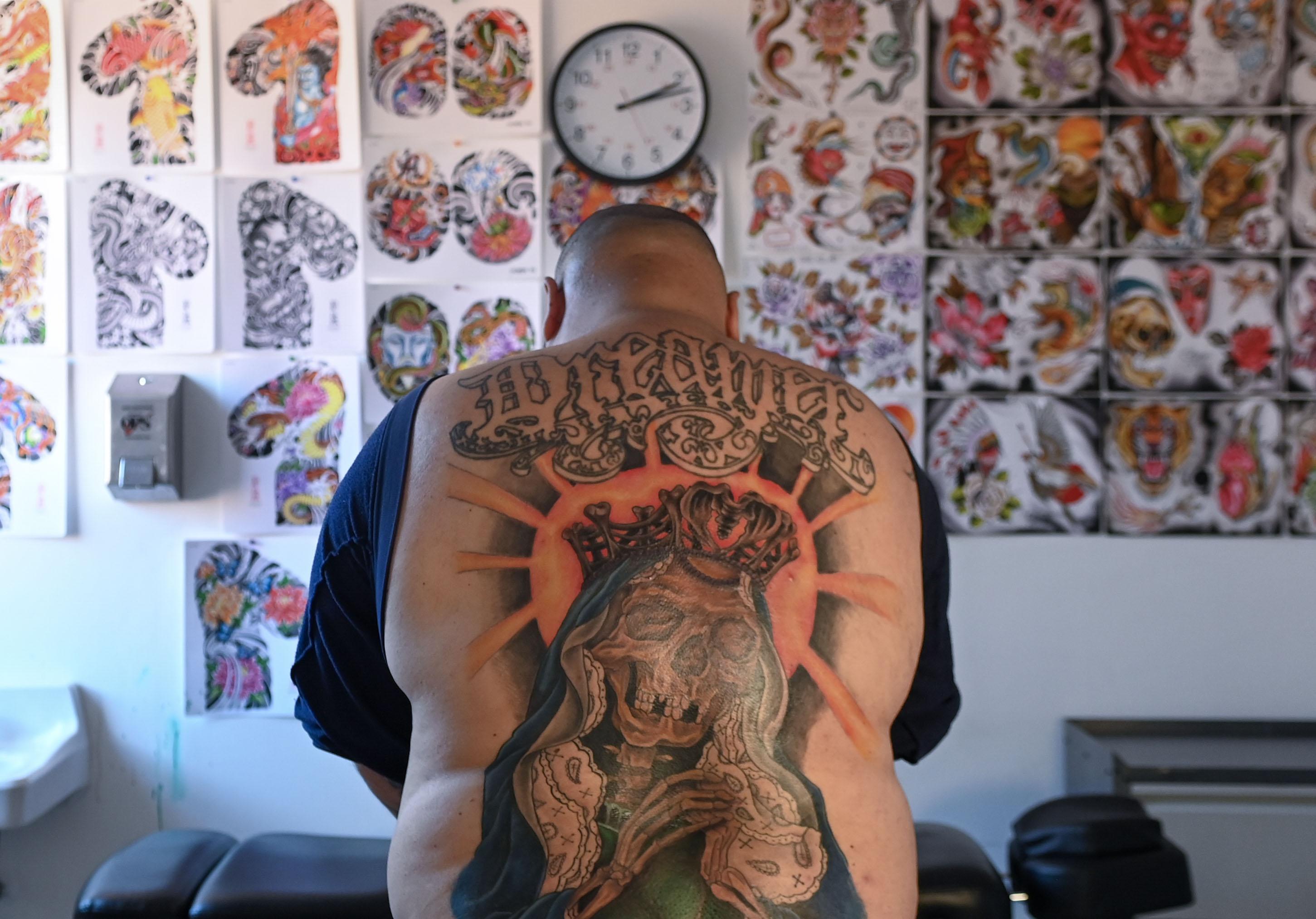 Bonilla displays a tattoo of Santa Muerte, the Mexican Folk Catholicism saint associated with healing, protection and safe delivery.