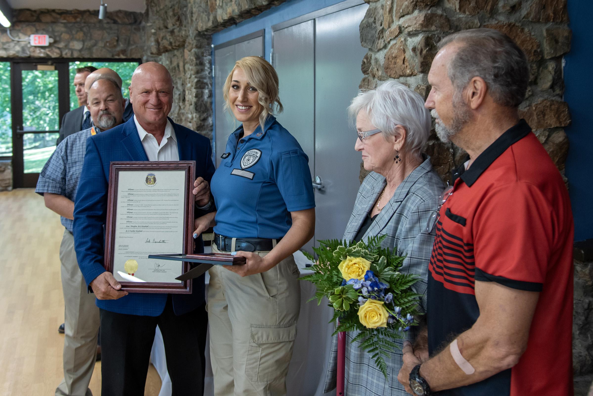Sergeant Scharihen Ward with state legislators and the Ellzey family