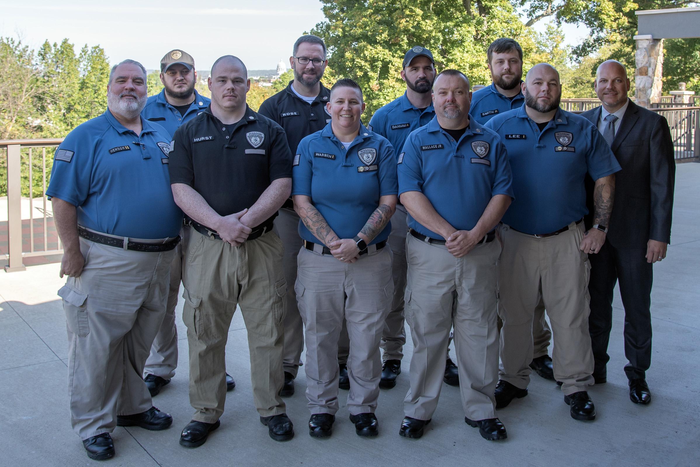 Eastern Reception, Diagnostic & Correctional Center team members Dustin Burcham, Kevin Dahmm, Joseph Hurst, Joshua Lee, Adrienne Warren, Steven Rose, Jacob Smith and David Wallace with Warden Richard Adams.