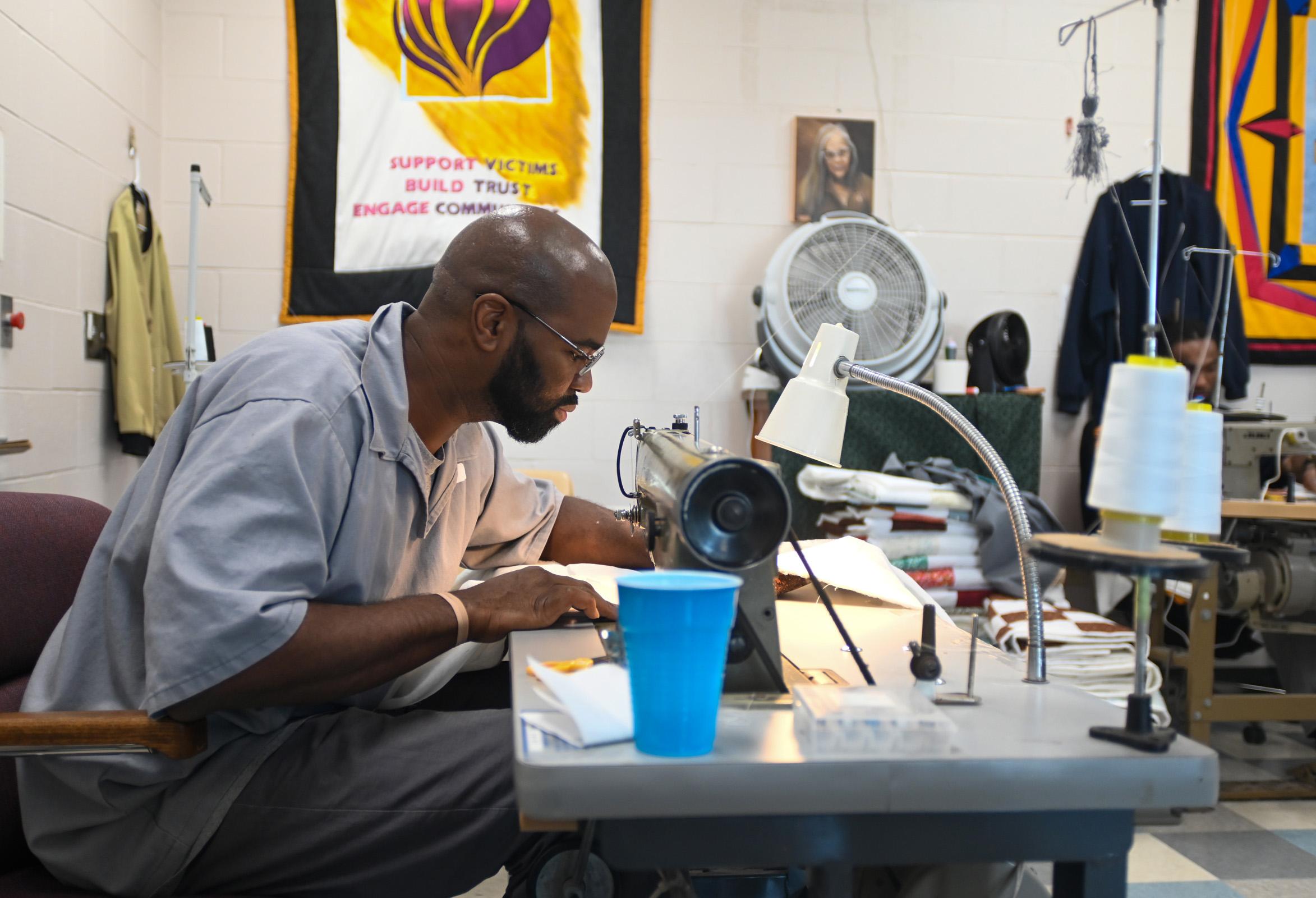 A Restorative Justice volunteer works on a piece. 