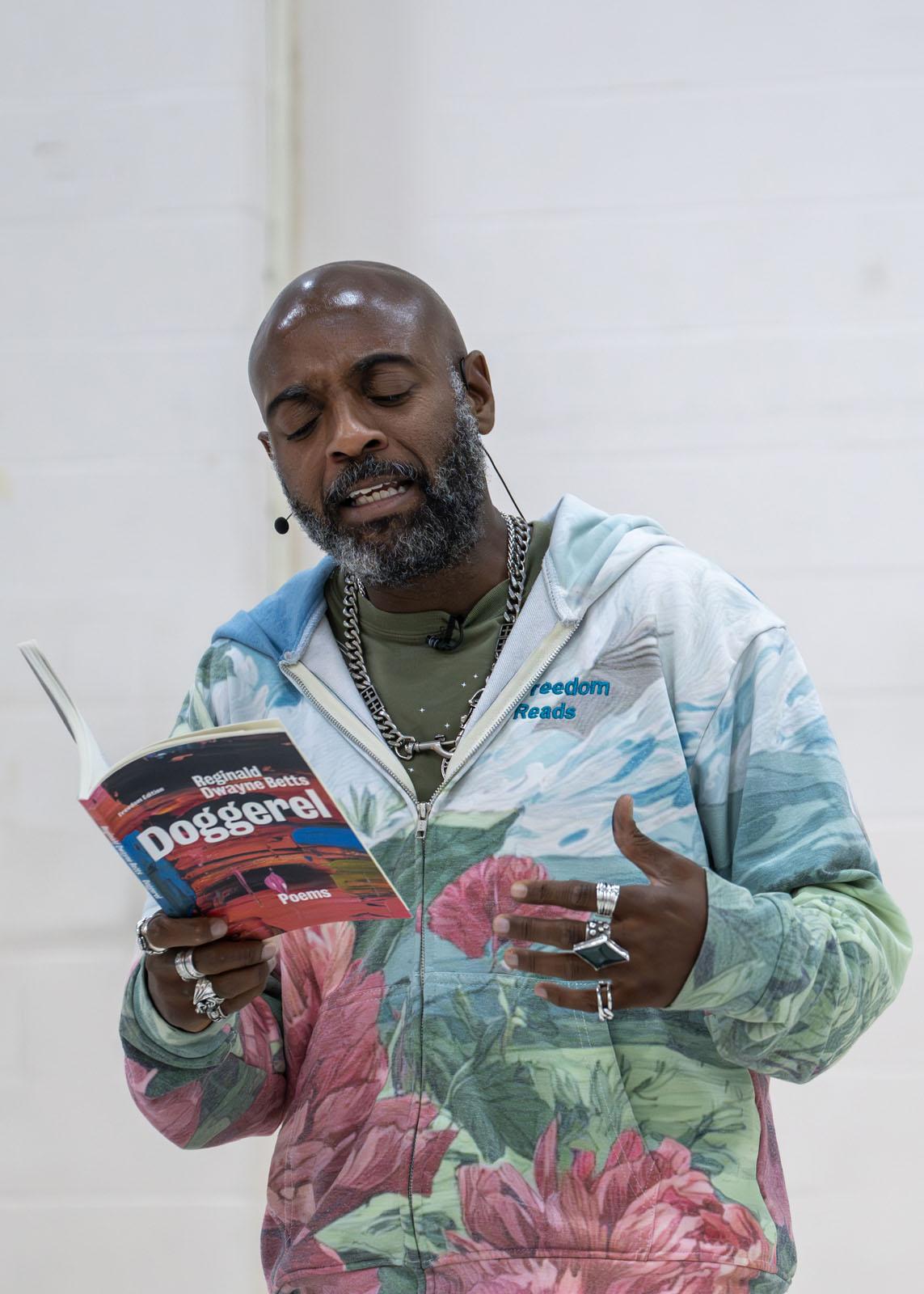 Reginald Dwayne Betts expressively reads aloud one of his poems.