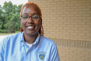 Young African-American woman in uniform.