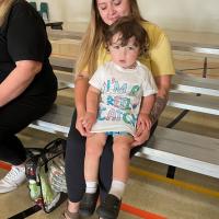 A toddler poses in a shirt that says "I'm a Reel Catch."